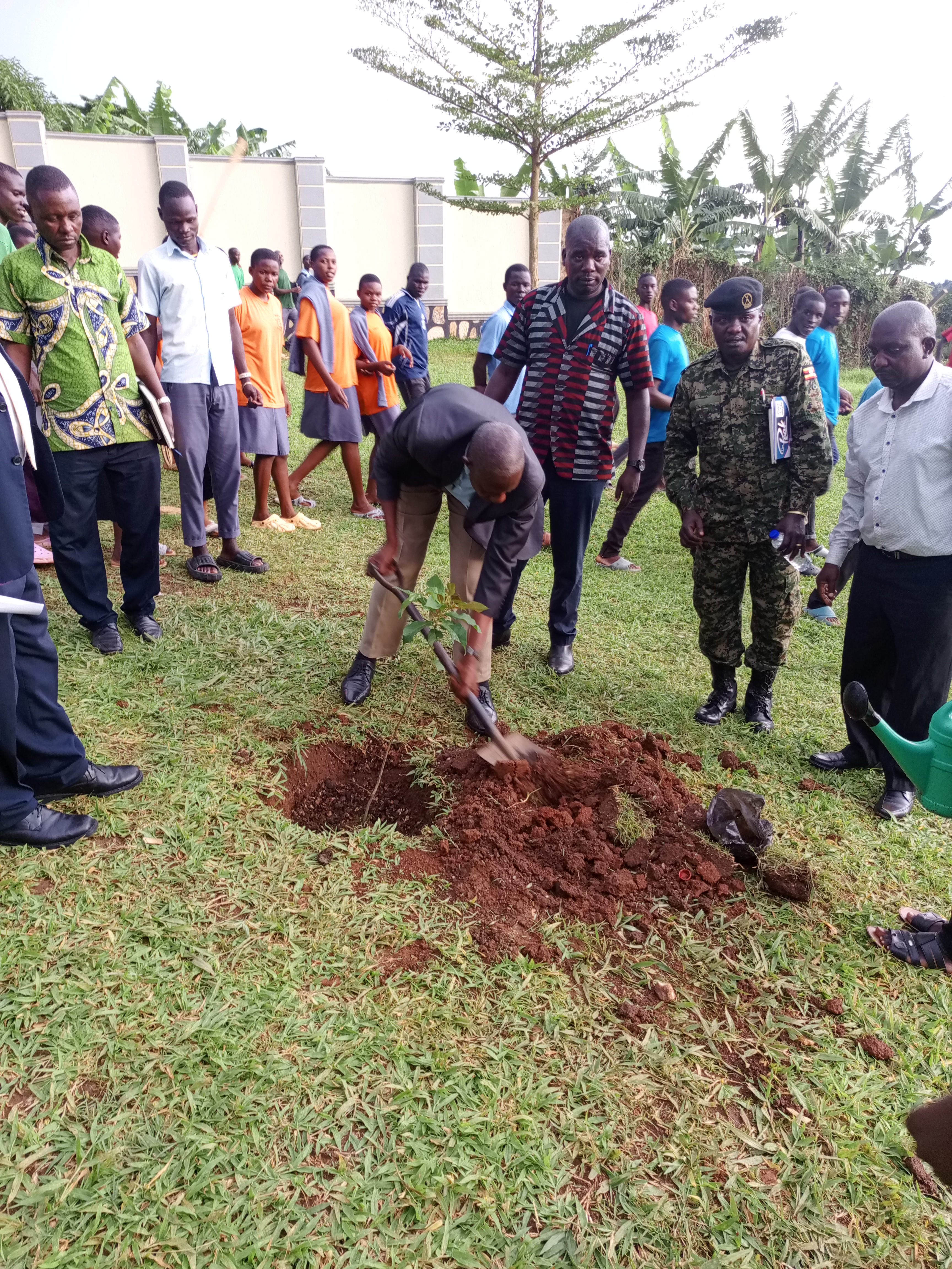 Students cleaning school compound