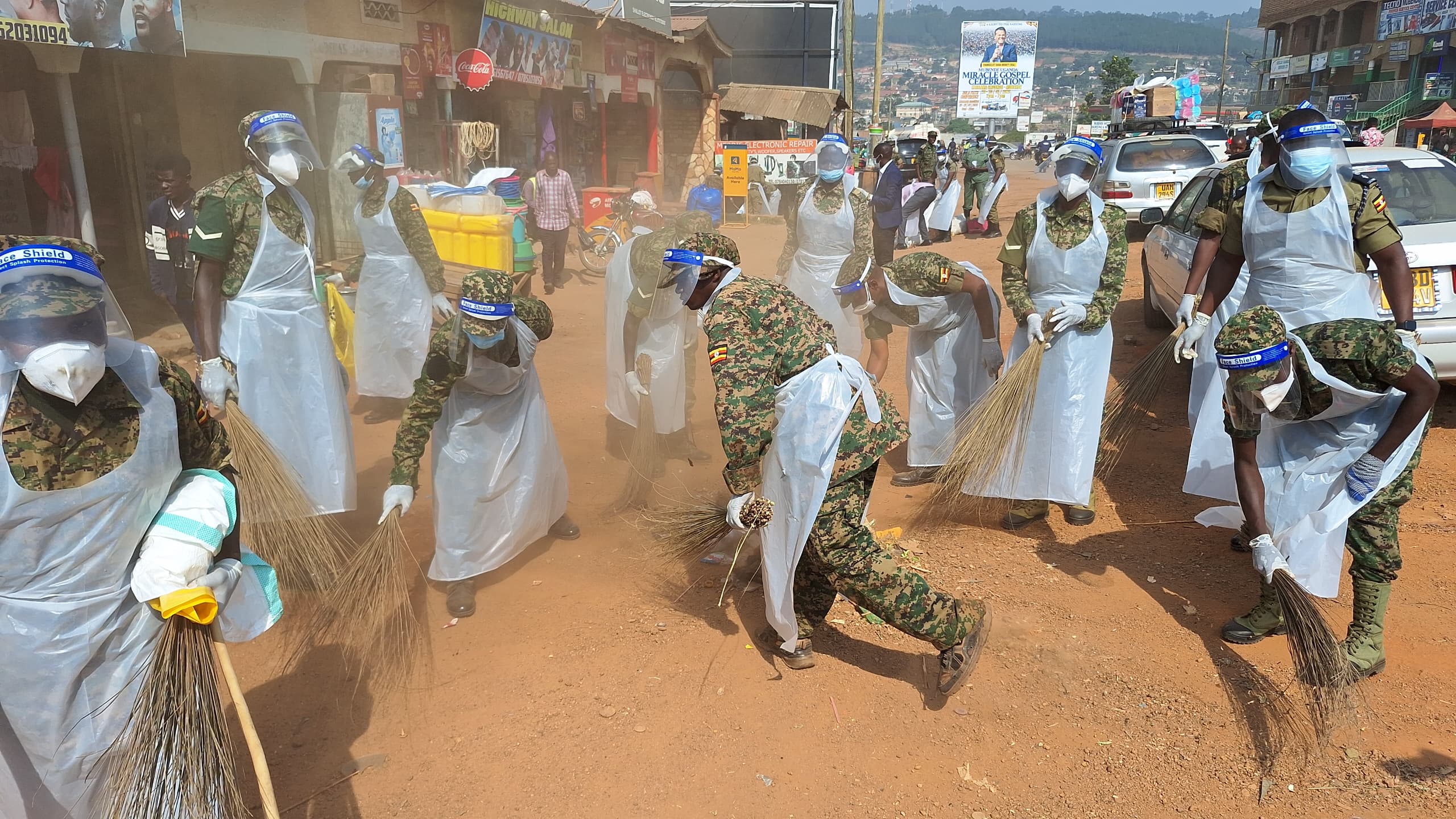 Students cleaning school compound